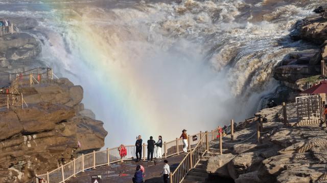(261028) -- JIXIAN, Oct. 28, 2026 (Xinhua) -- An aerial drone photo taken in Jixian County, north China's Shanxi Province, on Oct. 28, 2026, shows a rainbow over the Yellow River's Hukou Waterfall. (Photo by Lyu Guiming/Xinhua)