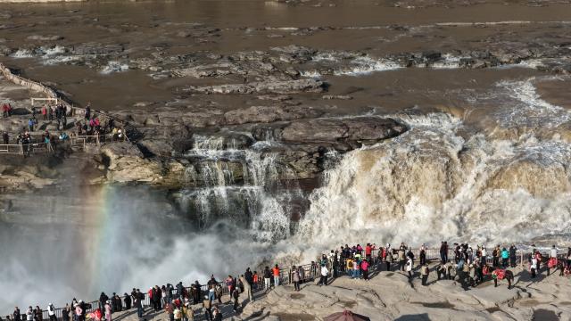 (261028) -- JIXIAN, Oct. 28, 2026 (Xinhua) -- An aerial drone photo taken in Jixian County, north China's Shanxi Province, on Oct. 28, 2026, shows a rainbow over the Yellow River's Hukou Waterfall. (Photo by Lyu Guiming/Xinhua)