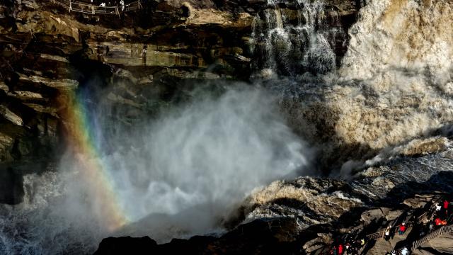 (261028) -- JIXIAN, Oct. 28, 2026 (Xinhua) -- An aerial drone photo taken in Jixian County, north China's Shanxi Province, on Oct. 28, 2026, shows a rainbow over the Yellow River's Hukou Waterfall. (Photo by Lyu Guiming/Xinhua)