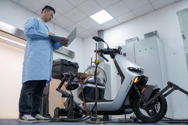 (261028) -- NANJING, Oct. 28, 2026 (Xinhua) -- An engineer debugs a two-wheeler at a smart electric two-wheeler company in Changzhou, east China's Jiangsu Province, Oct. 14, 2026.
  In recent years, Changzhou City has leveraged its traditional strengths in manufacturing to accelerate the clustering of electric two-wheeler manufacturers and their component suppliers, aiming at development of more smart and high-end products. 
  The city now accounts for about 10 percent of China's output of electric two-wheelers and has established a complete industrial chain spanning from parts to general assembly. 
  Changzhou has also actively reinforced the technological innovation as the main driver of the industry, as local makers keep boosting R&D efforts to further improve their products. (Xinhua/Li Bo)
