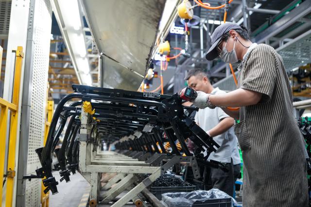 (261028) -- NANJING, Oct. 28, 2026 (Xinhua) -- Workers assemble frames at a production line of a smart electric two-wheeler company in Changzhou, east China's Jiangsu Province, Oct. 14, 2026.
  In recent years, Changzhou City has leveraged its traditional strengths in manufacturing to accelerate the clustering of electric two-wheeler manufacturers and their component suppliers, aiming at development of more smart and high-end products. 
  The city now accounts for about 10 percent of China's output of electric two-wheelers and has established a complete industrial chain spanning from parts to general assembly. 
  Changzhou has also actively reinforced the technological innovation as the main driver of the industry, as local makers keep boosting R&D efforts to further improve their products. (Xinhua/Li Bo)
