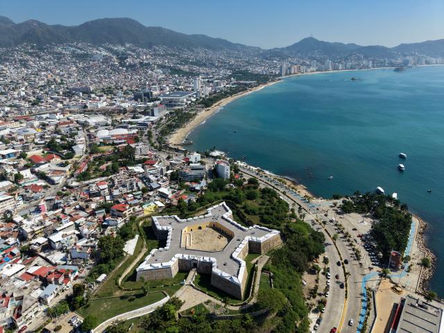 (261028) -- ACAPULCO, Oct. 28, 2026 (Xinhua) -- This aerial drone photo taken on Oct. 27, 2026 shows the Fort of San Diego and Acapulco Bay in Acapulco, Guerrero state, Mexico. First built in the 17th century, the fort once served to defend the port against pirate attacks and protect trading vessels arriving from Manila, the Philippines. It now houses the Historical Museum of Acapulco Fort of San Diego. The port city of Acapulco on Mexico's Pacific coast was once a major hub for trade between Asia and the Americas. In 1565, a Spanish galleon sailing from the Philippines reached Acapulco, helping establish a trans-Pacific maritime route. For approximately 250 years, the Manila Galleon trade connected Manila in the Philippines with Acapulco in Mexico, carrying Chinese silk, porcelain, and other Asian goods to the Americas and transporting silver from the Americas to Asia. Traces of this historic maritime trade can still be found in Acapulco today, from the centuries-old Fort of San Diego and Chinese porcelain displayed in its museum to models of sailing ships and a monument commemorating the Manila Galleon. (Xinhua/Li Muzi)