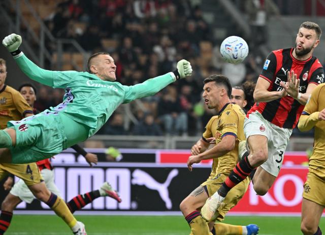 (261029) -- MILAN, Oct. 29, 2026 (Xinhua) -- Bologna's goalkeeper Lukasz Skorupski (L) makes a save during a Serie A football match between AC Milan and Bologna in Milan, Italy, Oct. 28, 2026. (Photo by Alberto Lingria/Xinhua)