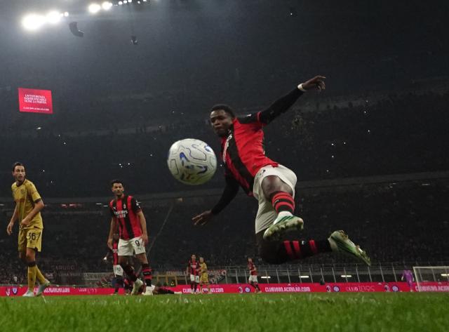 (261029) -- MILAN, Oct. 29, 2026 (Xinhua) -- AC Milan's Alphadjo Cisse (1st R) shoots to score during a Serie A football match between AC Milan and Bologna in Milan, Italy, Oct. 28, 2026. (Photo by Alberto Lingria/Xinhua)