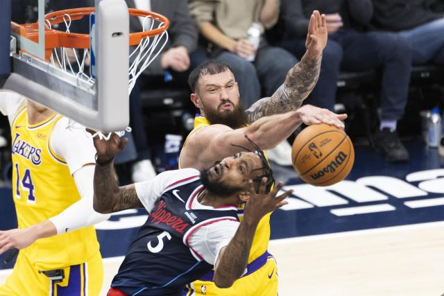 (261029) -- LOS ANGELES, Oct. 29, 2026 (Xinhua) -- Sandro Mamukelashvili (top) of Los Angeles Lakers blocks Derrick Jones Jr. of Los Angeles Clippers during the NBA basketball game between Los Angeles Lakers and Los Angeles Clippers in Los Angeles, the United States, Oct. 28, 2026. (Photo by Ringo Chiu/Xinhua)