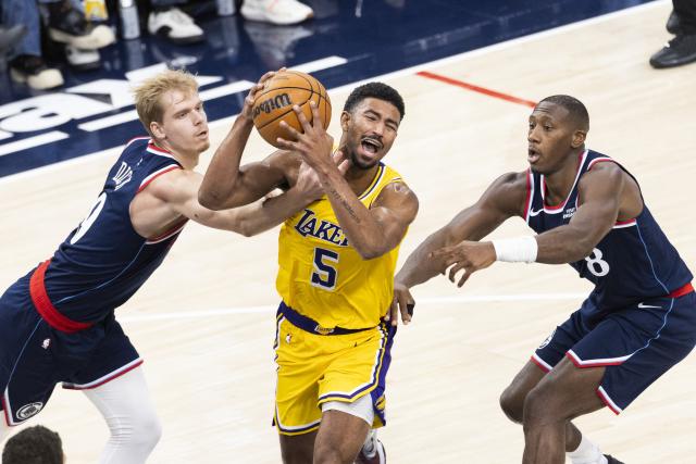 (261029) -- LOS ANGELES, Oct. 29, 2026 (Xinhua) -- Quentin Grimes (C) of Los Angeles Lakers vies for the ball with Gradey Dick (L) and Kris Dunn of Los Angeles Clippers during the NBA basketball game between Los Angeles Lakers and Los Angeles Clippers in Los Angeles, the United States, Oct. 28, 2026. (Photo by Ringo Chiu/Xinhua)