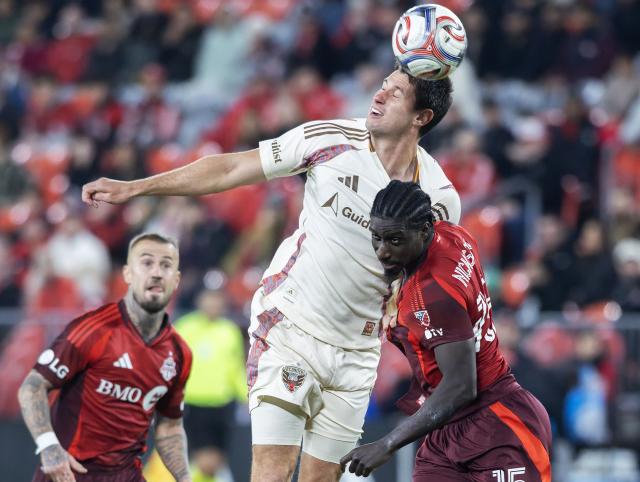 (261029) -- TORONTO, Oct. 29, 2026 (Xinhua) -- Nicksoen Gomis (R) of Toronto FC vies with Sean Nealis of D.C. United during the 2026 Major League Soccer(MLS) regular season football match between Toronto FC and D.C. United at BMO Field in Toronto, Canada, on Oct. 28, 2026. (Photo by Zou Zheng/Xinhua)
