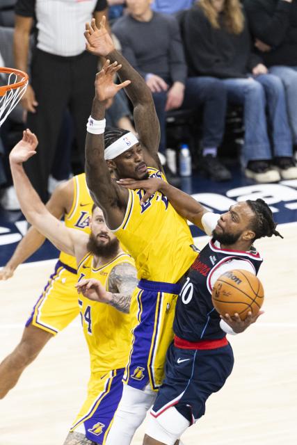 (261029) -- LOS ANGELES, Oct. 29, 2026 (Xinhua) -- Darius Garland (1st R) of Los Angeles Clippers goes to the basket against Jarred Vanderbilt (2nd R) of Los Angeles Lakers during the NBA basketball game between Los Angeles Lakers and Los Angeles Clippers in Los Angeles, the United States, Oct. 28, 2026. (Photo by Ringo Chiu/Xinhua)