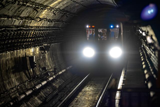 (261029) -- WUHAN, Oct. 29, 2026 (Xinhua) -- A train runs on the Wuhan Metro Line 12 in Wuhan, central China's Hubei Province, Oct. 29, 2026.
  China's longest subway loop line, the Wuhan Metro Line 12, started full line operation on Thursday. The 59.9-km line has 37 stations and stretches across seven administrative districts of the city. 
  By far, the total mileage of Wuhan Metro in operation has exceeded 581 kilometers. (Xinhua/Xiao Yijiu)