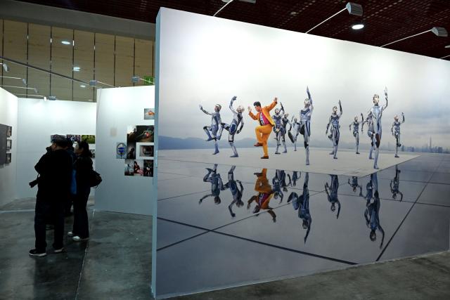 (261029) -- SANMENXIA, Oct. 29, 2026 (Xinhua) -- People visit an exhibition during the 16th China Photography Festival in Sanmenxia City, central China's Henan Province, Oct. 29, 2026. The 16th China Photography Festival kicked off here on Thursday, featuring exhibitions covering a variety of themes, including documentary and art. (Xinhua/Zhu Xiang)