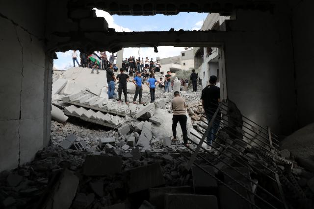 (261029) -- NABLUS, Oct. 29, 2026 (Xinhua) -- People look at the rubble of a Palestinian prisoner's house demolished by the Israeli army in the town of Beita, south of Nablus, West Bank, on Oct. 28, 2026. TO GO WITH "Israeli army demolishes 2 houses in Nablus, continues Hebron operation for 6th day" (Photo by Nidal Eshtayeh/Xinhua)