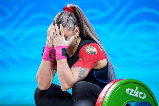 (261029) -- NINGBO, Oct. 29, 2026 (Xinhua) -- Mihaela-Valentina Cambei of Romania reacts after failing during the women's 53kg snatch event at the 2026 IWF World Championships in Ningbo, east China's Zhejiang Province, Oct. 29, 2026. (Xinhua/Jiang Han)