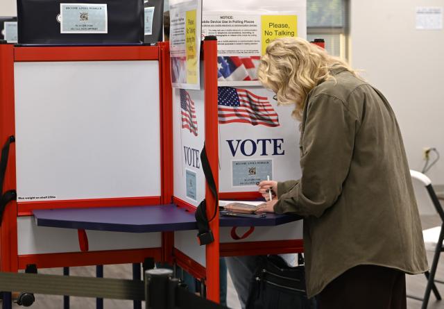 (261030) -- CHATTANOOGA, Oct. 30, 2026 (Xinhua) -- A woman fills out her ballot at a polling station in Chattanooga, Tennessee, the United States, on Oct. 29, 2026, days before the U.S. Midterm Election Day, which falls on Nov. 3. (Xinhua/Li Rui)