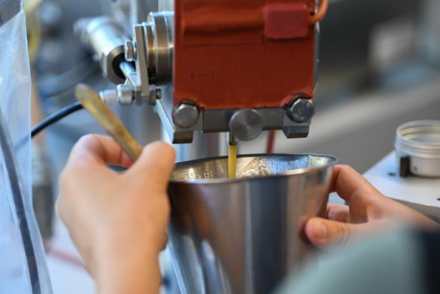 (261030) -- FRUTIGEN, Oct. 30, 2026 (Xinhua) -- A staff member works at a Puralpina workshop in Frutigen, Switzerland, Oct. 14, 2026. The ninth China International Import Expo (CIIE) is scheduled to take place in Shanghai from Nov. 5 to 10, 2026. Puralpina, a Swiss family business based in Frutigen in the Bernese Oberland, will exhibit at the expo for the second time, with twice as many product varieties as last year. (Xinhua/Lian Yi)