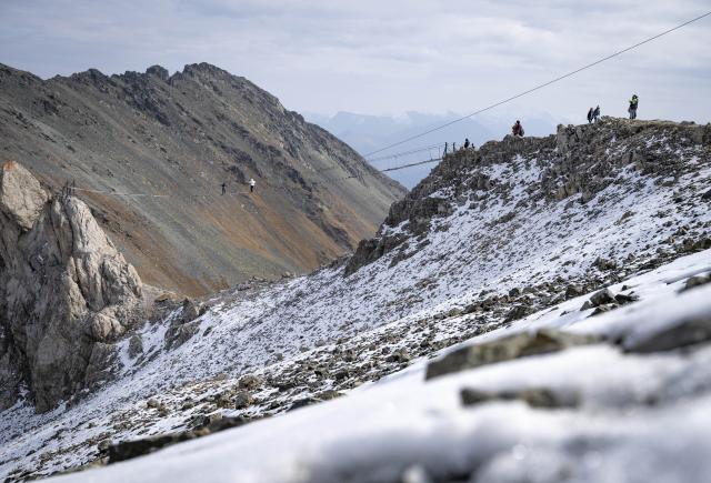 (261030) -- CHERKESSK, Oct. 30, 2026 (Xinhua) -- Tourists go sightseeing in the Arkhyz resort area in the Karachay-Cherkessia Republic, Russia, Oct. 29, 2026. Arkhyz is a mountain village and a well-known tourist resort at the foot of the Greater Caucasus Mountains in the Karachay-Cherkessia Republic in southern Russia. (Xinhua/Feng Kaihua)