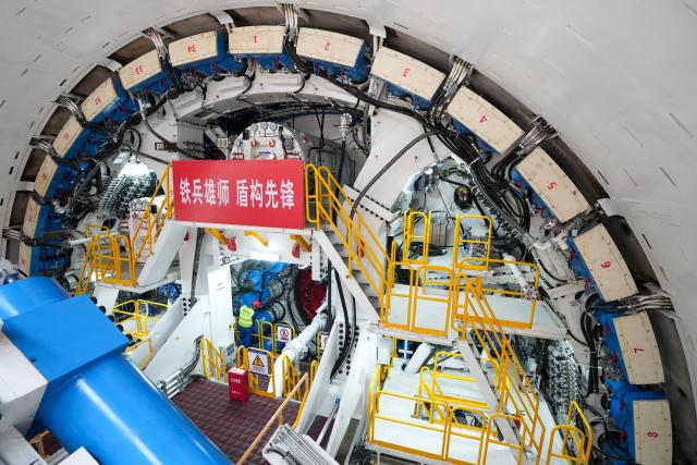 (261030) -- NANJING, Oct. 30, 2026 (Xinhua) -- A constructor works at the construction site of the Taihu Lake tunnel section of the Wuxi-Yixing S2 Line in east China's Jiangsu Province, Oct. 29, 2026. The shield-driven excavation work on the Taihu Lake tunnel section of the Wuxi-Yixing S2 Line officially began in Wuxi on Thursday.
   The 61.48-kilometer-long Wuxi-Yixing S2 Line is designed for a speed of 160 kilometers per hour and will feature nine stations, with a 21.6-kilometer-long tunnel beneath Taihu Lake. (Xinhua/Li Bo)