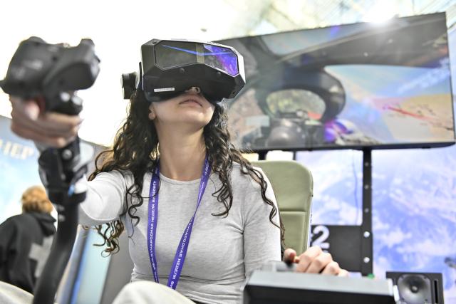 (261030) -- MOSCOW, Oct. 30, 2026 (Xinhua) -- A visitor plays a game during the 2nd Moscow International Game Week in Moscow, Russia, Oct. 30, 2026. The event kicked off here on Thursday and will run until Nov. 1. (Photo by Alexander Zemlianichenko Jr/Xinhua)