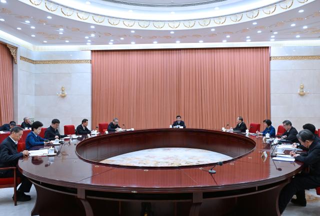 (261030) -- BEIJING, Oct. 30, 2026 (Xinhua) -- Wang Huning, a member of the Standing Committee of the Political Bureau of the Communist Party of China (CPC) Central Committee, chairman of the Chinese People's Political Consultative Conference (CPPCC) National Committee and secretary of its leading Party members' group, presides over a meeting of the group to study and discuss plans to implement the guiding principles from the just-concluded fifth plenary session of the 20th CPC Central Committee in Beijing, capital of China, Oct. 30, 2026. (Xinhua/Rao Aimin)