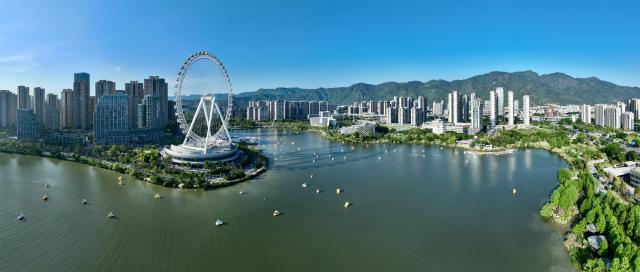 (261030) -- FUZHOU, Oct. 30, 2026 (Xinhua) -- A panoramic drone photo taken on May 1, 2026 shows a view in the Jin'an Lake Park in Fuzhou, southeast China's Fujian Province. Fuzhou, located on the coast of the East China Sea and the banks of the Minjiang River, is a renowned historical city with a history of over 2,200 years. Relying on its natural endowments and cultural heritage, Fuzhou has coordinated urban renewal, ecological governance, cultural heritage preservation and other aspects to promote high-quality and sustainable urban development. (Xinhua/Jiang Kehong)