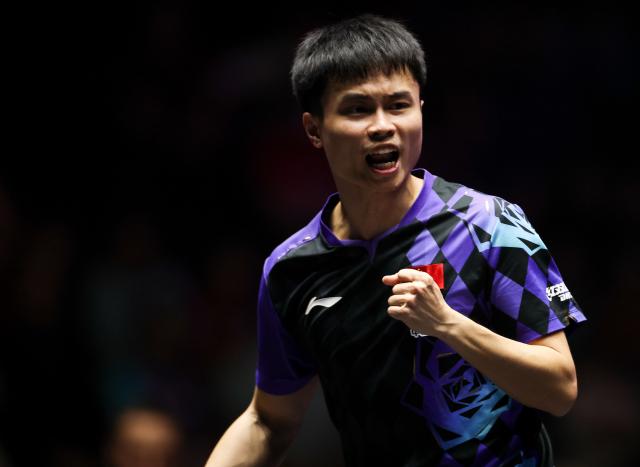 (261031) -- MONTPELLIER, Oct. 31, 2026 (Xinhua) -- Zhou Qihao of China reacts during the men's singles round of 16 match between Zhou Qihao of China and Felix Lebrun of France at the WTT Champions Montpellier 2026 in Montpellier, France, on Oct. 30, 2026. (Xinhua/Wu Huiwo)