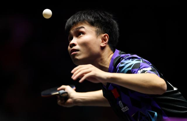 (261031) -- MONTPELLIER, Oct. 31, 2026 (Xinhua) -- Zhou Qihao of China serves during the men's singles round of 16 match between Zhou Qihao of China and Felix Lebrun of France at the WTT Champions Montpellier 2026 in Montpellier, France, on Oct. 30, 2026. (Xinhua/Wu Huiwo)