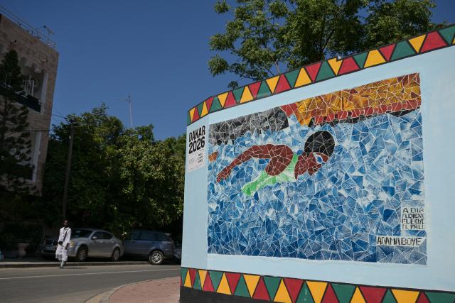 (261031) -- DAKAR, Oct. 31, 2026 (Xinhua) -- This photo taken on Oct. 30, 2026 shows a mural promoting the swimming events of the Youth Olympic Games ahead of the Dakar 2026 Youth Olympic Games in Dakar, Senegal. (Xinhua/Yang Guang)