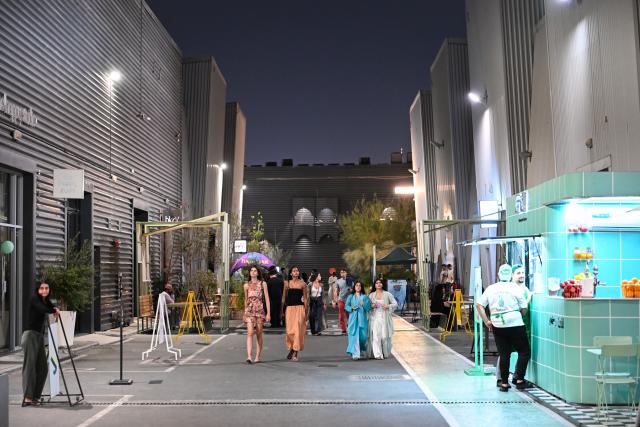 (261031) -- DUBAI, Oct. 31, 2026 (Xinhua) -- People visit Alserkal Avenue in Dubai, the United Arab Emirates, Oct. 30, 2026. Alserkal Avenue is a well-known cultural and arts hub in Dubai. In recent years, former industrial warehouses here have been transformed into a vibrant creative district through renovation and adaptive reuse. Today, it hosts contemporary art exhibitions, creative design events, cultural exchanges, and leisure activities, attracting artists, creative professionals, and visitors. (Xinhua/Wang Zecong)