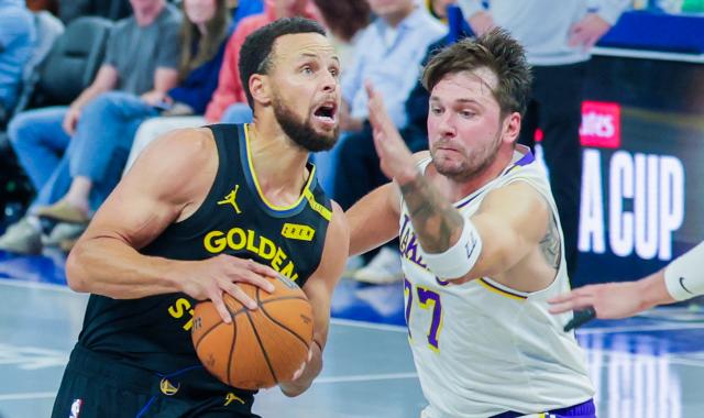 (261031) -- SAN FRANCISCO, Oct. 31, 2026 (Xinhua) -- Stephen Curry (L) of Golden State Warriors drives past Luka Doncic of Los Angeles Lakers during the 2026-2027 NBA Cup group match between Golden State Warriors and Los Angeles Lakers in San Francisco, the United States, Oct. 30, 2026. (Photo by Arthur Dong/Xinhua)