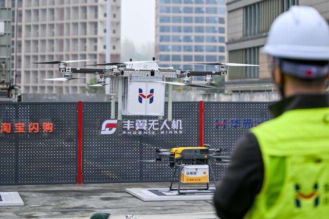 (261031) -- QINGZHEN, Oct. 31, 2026 (Xinhua) -- A drone carrying takeout food takes off from a control center for low-altitude logistics service in Qingzhen City, southwest China's Guizhou Province, Oct. 30, 2026. Recently, the mountainous southwestern Chinese province of Guizhou has officially launched its first campus low-altitude drone delivery route in Qingzhen vocational education town. The aerial route connects local commercial districts directly to campuses, cutting the delivery time for teachers and students to less than 20 minutes with delivery fees starting at 3.8 yuan (about 0.57 U.S. dollars). The service also helps build a training platform integrating low-altitude industry and education to support talent cultivation. (Photo by Yuan Fuhong/Xinhua)
