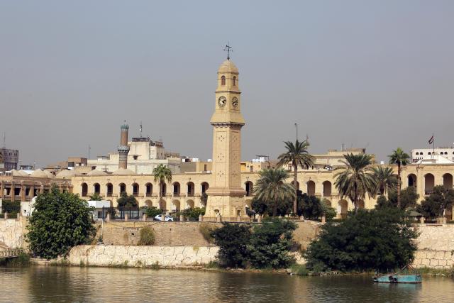 (261031) -- BAGHDAD, Oct. 31, 2026 (Xinhua) -- This photo taken on Oct. 21, 2026 shows the Qishla Clock Tower by the Tigris River in Baghdad, Iraq. October 31 marks World Cities Day. (Xinhua/Khalil Dawood)