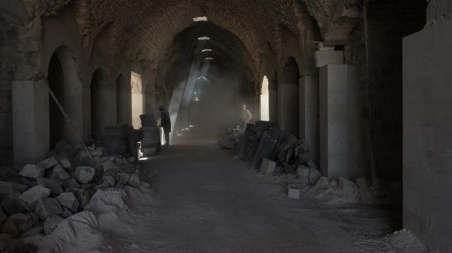 (261031) -- ALEPPO, Oct. 31, 2026 (Xinhua) -- Workers conduct restoration work inside a market in the Old City of Aleppo, Syria, July 20, 2026. October 31 marks World Cities Day. In recent years, some cities across the Middle East have been battered by war. Buildings have been damaged, infrastructure destroyed, and once-bustling streets and houses have been reduced to rubble. War has not only transformed the urban landscape but also profoundly affected the daily lives of local residents. (Photo by Monsef Memari/Xinhua)