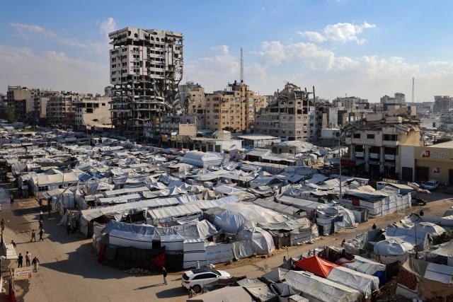 (261031) -- GAZA CITY, Oct. 31, 2026 (Xinhua) -- Tents are seen in central Gaza City, on Oct. 28, 2026. October 31 marks World Cities Day. In recent years, some cities across the Middle East have been battered by war. Buildings have been damaged, infrastructure destroyed, and once-bustling streets and houses have been reduced to rubble. War has not only transformed the urban landscape but also profoundly affected the daily lives of local residents. (Photo by Rizek Abdeljawad/Xinhua)