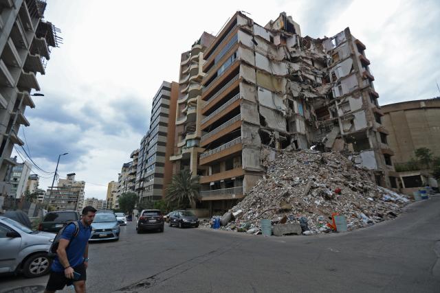 (261031) -- BEIRUT, Oct. 31, 2026 (Xinhua) -- This photo taken on Oct. 29, 2026 shows a building destroyed by war in Beirut, Lebanon. October 31 marks World Cities Day. In recent years, some cities across the Middle East have been battered by war. Buildings have been damaged, infrastructure destroyed, and once-bustling streets and houses have been reduced to rubble. War has not only transformed the urban landscape but also profoundly affected the daily lives of local residents. (Xinhua/Bilal Jawich)