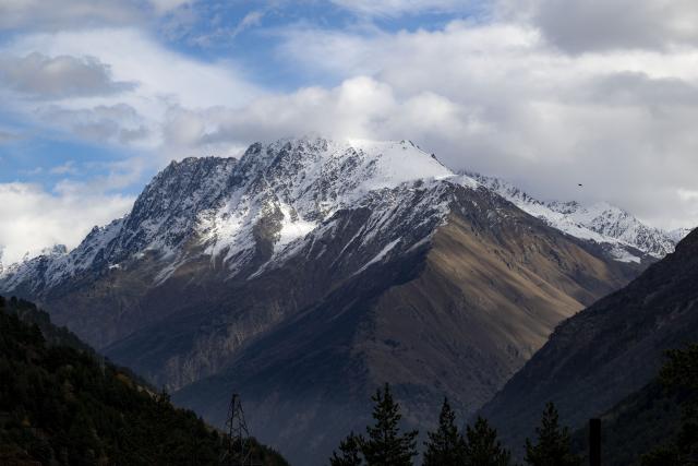 (261031) -- NALCHIK, Oct. 31, 2026 (Xinhua) -- This photo taken on Oct. 30, 2026 shows mountains near the Mount Elbrus in Russia's Kabardino-Balkaria Republic. Mount Elbrus is the highest peak in Europe. (Xinhua/Feng Kaihua)