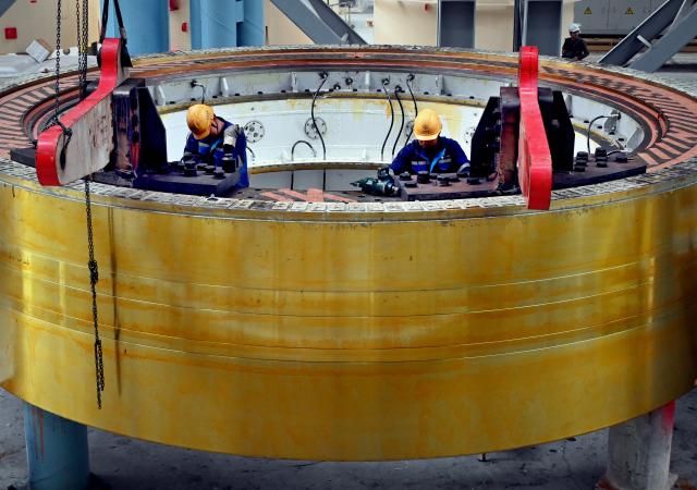 (261031) -- CHANGSHU, Oct. 31, 2026 (Xinhua) -- Staff members work at a machinery equipment manufacturing company in Changshu, east China's Jiangsu Province, Oct. 30, 2026. Changshu has focused on high-quality development in recent years, intensifying efforts to improve the comprehensive strength in both traditional and emerging fields of its manufacturing sector. (Xinhua/Li An)
