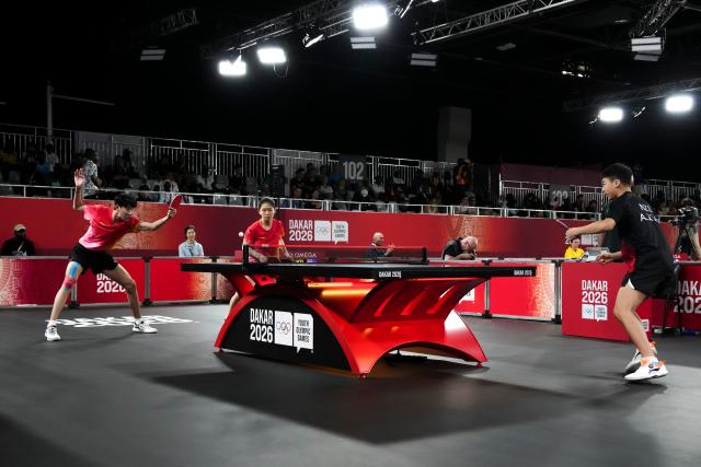 (261031) -- DIAMNIADIO, Oct. 31, 2026 (Xinhua) -- Li Hechen (1st L)/Yao Ruixuan (2nd L) of China compete during the mixed doubles round of 16 match of table tennis against August Xiao/Han Anzhuo of New Zealand at the Dakar 2026 Youth Olympic Games in Diamniadio, Senegal, Oct. 31, 2026. (Xinhua/Na Yuqi)