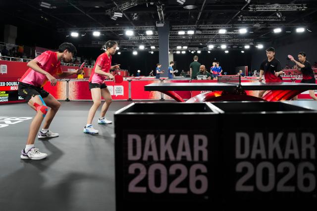 (261031) -- DIAMNIADIO, Oct. 31, 2026 (Xinhua) -- Li Hechen (1st L)/Yao Ruixuan (2nd L) of China compete during the mixed doubles round of 16 match of table tennis against August Xiao/Han Anzhuo of New Zealand at the Dakar 2026 Youth Olympic Games in Diamniadio, Senegal, Oct. 31, 2026. (Xinhua/Na Yuqi)