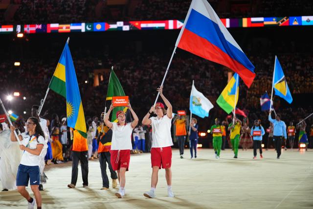 (261031) -- DAKAR, Oct. 31, 2026 (Xinhua) -- Flagbearers of Russia parade into the stadium during the opening ceremony of the 2026 Youth Olympic Games in Dakar, Senegal, Oct. 31, 2026. (Xinhua/Xie Jianfei)