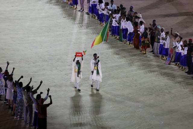 (261031) -- DAKAR, Oct. 31, 2026 (Xinhua) -- Flagbearers of Senegal parade into the stadium during the opening ceremony of the 2026 Youth Olympic Games in Dakar, Senegal, Oct. 31, 2026. (Xinhua/Chen Wei)