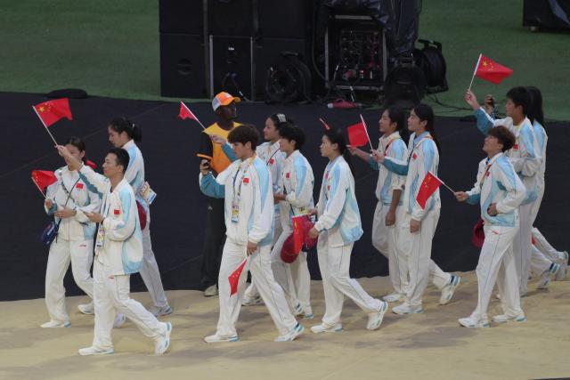 (261031) -- DAKAR, Oct. 31, 2026 (Xinhua) -- The delegation of China parades into the stadium during the opening ceremony of the 2026 Youth Olympic Games in Dakar, Senegal, Oct. 31, 2026. (Xinhua/Yang Guang)