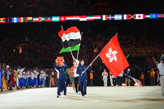 (261031) -- DAKAR, Oct. 31, 2026 (Xinhua) -- Flagbearers of China's Hong Kong parade into the stadium during the opening ceremony of the 2026 Youth Olympic Games in Dakar, Senegal, Oct. 31, 2026. (Xinhua/Xie Jianfei)