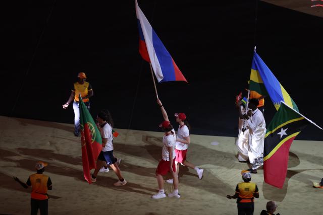 (261031) -- DAKAR, Oct. 31, 2026 (Xinhua) -- Flagbearers of Russia parade into the stadium during the opening ceremony of the 2026 Youth Olympic Games in Dakar, Senegal, Oct. 31, 2026. (Xinhua/Chen Wei)