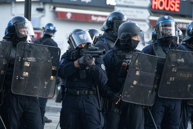 (261031) -- LILLE, Oct. 31, 2026 (Xinhua) -- Security personnel work on the street in Lille, France, Oct. 31, 2026. Around 320,000 people took part in a new round of protests across France on Saturday, according to French daily Le Monde which cited figures from the Interior Ministry. (Photo by Sebastien Courdji/Xinhua)