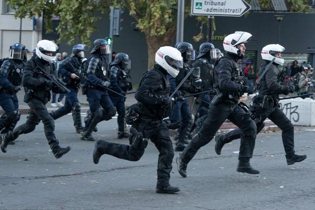 (261031) -- LILLE, Oct. 31, 2026 (Xinhua) -- Security personnel work on the street in Lille, France, Oct. 31, 2026. Around 320,000 people took part in a new round of protests across France on Saturday, according to French daily Le Monde which cited figures from the Interior Ministry. (Photo by Sebastien Courdji/Xinhua)