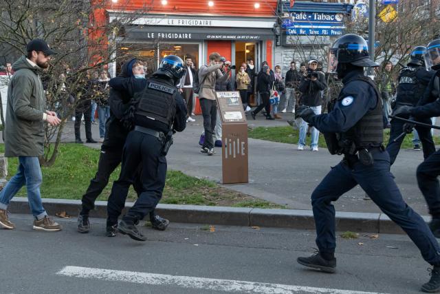 (261031) -- LILLE, Oct. 31, 2026 (Xinhua) -- Security personnel take away a protester in Lille, France, Oct. 31, 2026. Around 320,000 people took part in a new round of protests across France on Saturday, according to French daily Le Monde which cited figures from the Interior Ministry. (Photo by Sebastien Courdji/Xinhua)