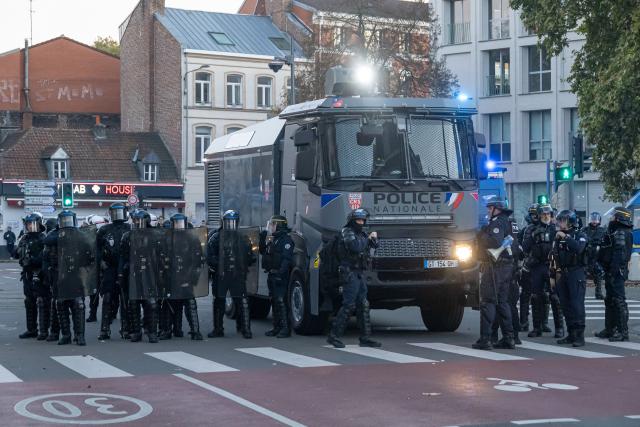 (261031) -- LILLE, Oct. 31, 2026 (Xinhua) -- Security personnel work on the street in Lille, France, Oct. 31, 2026. Around 320,000 people took part in a new round of protests across France on Saturday, according to French daily Le Monde which cited figures from the Interior Ministry. (Photo by Sebastien Courdji/Xinhua)